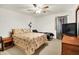 Bright bedroom with ceiling fan, featuring a patterned bedspread and natural light at 5063 Haywood Ln, Plainfield, IN 46168