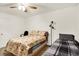 Neutral bedroom with a ceiling fan, and two beds with patterned bedspreads at 5063 Haywood Ln, Plainfield, IN 46168