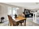 This dining space features a wooden table and connects to the living area at 5063 Haywood Ln, Plainfield, IN 46168