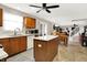 Bright kitchen featuring wood cabinets, central island, stainless steel appliances, and an open floor plan at 5063 Haywood Ln, Plainfield, IN 46168