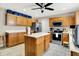 Kitchen features ample cabinet space, an island, and stainless steel appliances at 5063 Haywood Ln, Plainfield, IN 46168
