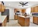 Beautiful kitchen with brown cabinets, stainless steel appliances, and an island at 5063 Haywood Ln, Plainfield, IN 46168