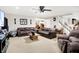 Neutral living room with two leather couches and a view of the stairs at 5063 Haywood Ln, Plainfield, IN 46168