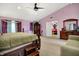 Bright main bedroom featuring carpeting, a ceiling fan, and plenty of space for furniture at 5063 Haywood Ln, Plainfield, IN 46168
