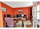 Home office with red walls, neutral carpet and multiple monitors at 5063 Haywood Ln, Plainfield, IN 46168