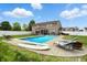 Backyard pool with lounge seating, a screened in porch, and a privacy fence at 5063 Haywood Ln, Plainfield, IN 46168