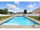 Sparkling in-ground pool with lounge chairs, surrounded by a manicured lawn at 5063 Haywood Ln, Plainfield, IN 46168