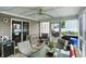Relaxing screened-in sunroom with seating and views of the backyard at 5063 Haywood Ln, Plainfield, IN 46168