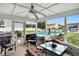 Relaxing screened-in sunroom offering views of the pool and backyard at 5063 Haywood Ln, Plainfield, IN 46168