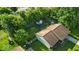 A bird's-eye perspective shows a well-maintained yard featuring mature trees and a trampoline for outdoor Gathering fun at 5201 Gringo Dr, Indianapolis, IN 46237