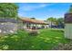 Backyard with a shed and trampoline on a sunny day at 5201 Gringo Dr, Indianapolis, IN 46237