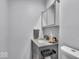 Modern bathroom featuring vanity with a stone countertop, and storage at 5201 Gringo Dr, Indianapolis, IN 46237