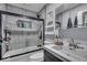 Nicely tiled bathtub and shower combo with a modern sink and vanity at 5201 Gringo Dr, Indianapolis, IN 46237