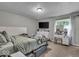 Cozy bedroom with neutral tones, comfortable bedding, and ample natural light at 5201 Gringo Dr, Indianapolis, IN 46237