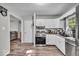Well-equipped kitchen with modern appliances, white cabinets, and convenient layout at 5201 Gringo Dr, Indianapolis, IN 46237