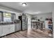 Bright eat-in kitchen with stainless steel appliances, wood floors and a view to the yard at 5201 Gringo Dr, Indianapolis, IN 46237