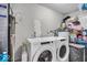 Functional laundry room with modern washing and drying machines at 5201 Gringo Dr, Indianapolis, IN 46237