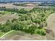 A lovely aerial view of a secluded property surrounded by lush greenery and open fields at 5240 W 400 N, Fairland, IN 46126