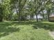 Lush backyard with mature trees offers a serene setting at 5240 W 400 N, Fairland, IN 46126