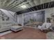 Finished basement featuring a cozy seating area and unique deer-themed mural at 5240 W 400 N, Fairland, IN 46126