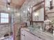 Stylish bathroom featuring stone wall accent, glass bowl sink and decorative lighting at 5240 W 400 N, Fairland, IN 46126