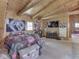 Bedroom featuring sloped wood ceilings, a bed, posters and casual seating at 5240 W 400 N, Fairland, IN 46126