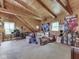 Unique bedroom with vaulted wood ceilings, posters, and casual seating at 5240 W 400 N, Fairland, IN 46126