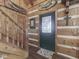 Charming log home entryway features a unique door and fish decor at 5240 W 400 N, Fairland, IN 46126