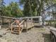 Airstream trailer with wooden deck among trees at 5240 W 400 N, Fairland, IN 46126