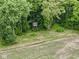 A hunting blind is seen nestled among the trees in a field at 5240 W 400 N, Fairland, IN 46126