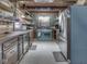 Farmhouse style kitchen boasts open shelving and stainless steel appliances at 5240 W 400 N, Fairland, IN 46126
