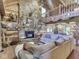 Cozy living room with a stone fireplace, vaulted ceilings, and rustic decor at 5240 W 400 N, Fairland, IN 46126
