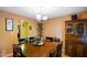 An inviting dining room with a wooden table, complemented by a hutch and natural light at 526 W Hunters Dr # C, Carmel, IN 46032