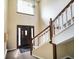 Inviting entryway showcasing staircase, large window, and stylish front door creates a warm ambiance at 526 W Hunters Dr # C, Carmel, IN 46032