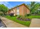 Well-maintained brick condo building featuring manicured lawn and tasteful shrubbery adding curb appeal at 526 W Hunters Dr # C, Carmel, IN 46032