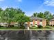 Well-maintained brick condo complex with lush green landscaping and ample parking, perfect for residents and guests at 526 W Hunters Dr # C, Carmel, IN 46032