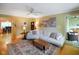 Comfortable living room featuring a plush sofa, area rug, and an open flow to the dining area at 526 W Hunters Dr # C, Carmel, IN 46032