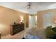 Bright main bedroom featuring a ceiling fan, a large closet, and a view to the adjacent room at 526 W Hunters Dr # C, Carmel, IN 46032