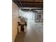 The unfinished basement includes a utility sink and washer/dryer hookups at 5378 Rosslyn Ave, Indianapolis, IN 46220