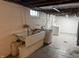 The unfinished basement includes a utility sink, washer, and dryer at 5378 Rosslyn Ave, Indianapolis, IN 46220