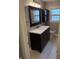 Tastefully updated bathroom featuring modern vanity and a large mirror at 5378 Rosslyn Ave, Indianapolis, IN 46220
