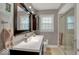 Updated bathroom featuring a sleek vanity, modern lighting, and glass-enclosed shower at 5378 Rosslyn Ave, Indianapolis, IN 46220