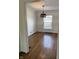 This dining area features hardwood floors and a stylish light fixture at 5378 Rosslyn Ave, Indianapolis, IN 46220