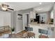 Open kitchen area with breakfast bar, updated appliances, and lots of natural light at 5378 Rosslyn Ave, Indianapolis, IN 46220