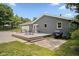 Rear exterior view featuring a wood deck with outdoor seating and gray painted brick at 540 Lazy Ln, Greenwood, IN 46142