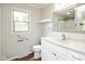 Bright bathroom with white vanity, window, and updated fixtures for a modern appeal at 540 Lazy Ln, Greenwood, IN 46142