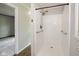 Bathroom showcasing walk-in shower with grab bars and textured white tiling at 540 Lazy Ln, Greenwood, IN 46142