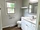 Bathroom with updated vanity and fixtures, a bright window, and accessibility features at 540 Lazy Ln, Greenwood, IN 46142