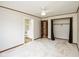Bright bedroom with neutral carpet, ceiling fan, closet, and connecting bath at 540 Lazy Ln, Greenwood, IN 46142