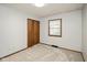This bedroom features neutral carpet, a closet with standard hinged doors, and a window at 540 Lazy Ln, Greenwood, IN 46142